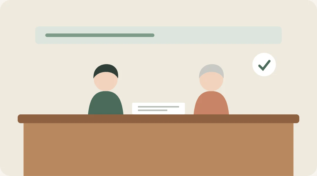 窓口で担当者と向き合って相談するイラスト